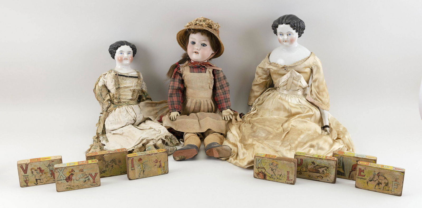 THREE GERMAN DOLLS AND EIGHT LITHOGRAPHED WOODEN (1 of 1)
