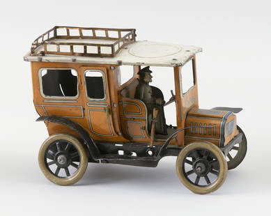 GREPPERT & KELCH TIN WINDUP CAR: GREPPERT & KELCH TIN WINDUP CARGermany, Circa 1920Painted yellow.Length 7".