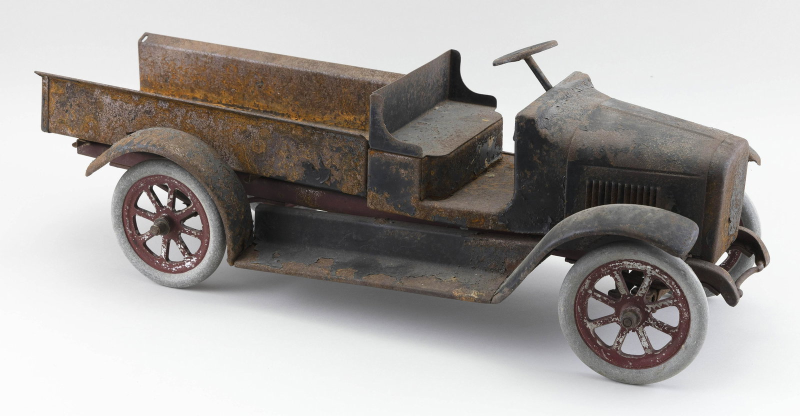 BUDDY L PRESSED STEEL TRUCK: BUDDY L PRESSED STEEL TRUCK 20th Century Shows traces of black and red paint. Length 24”.