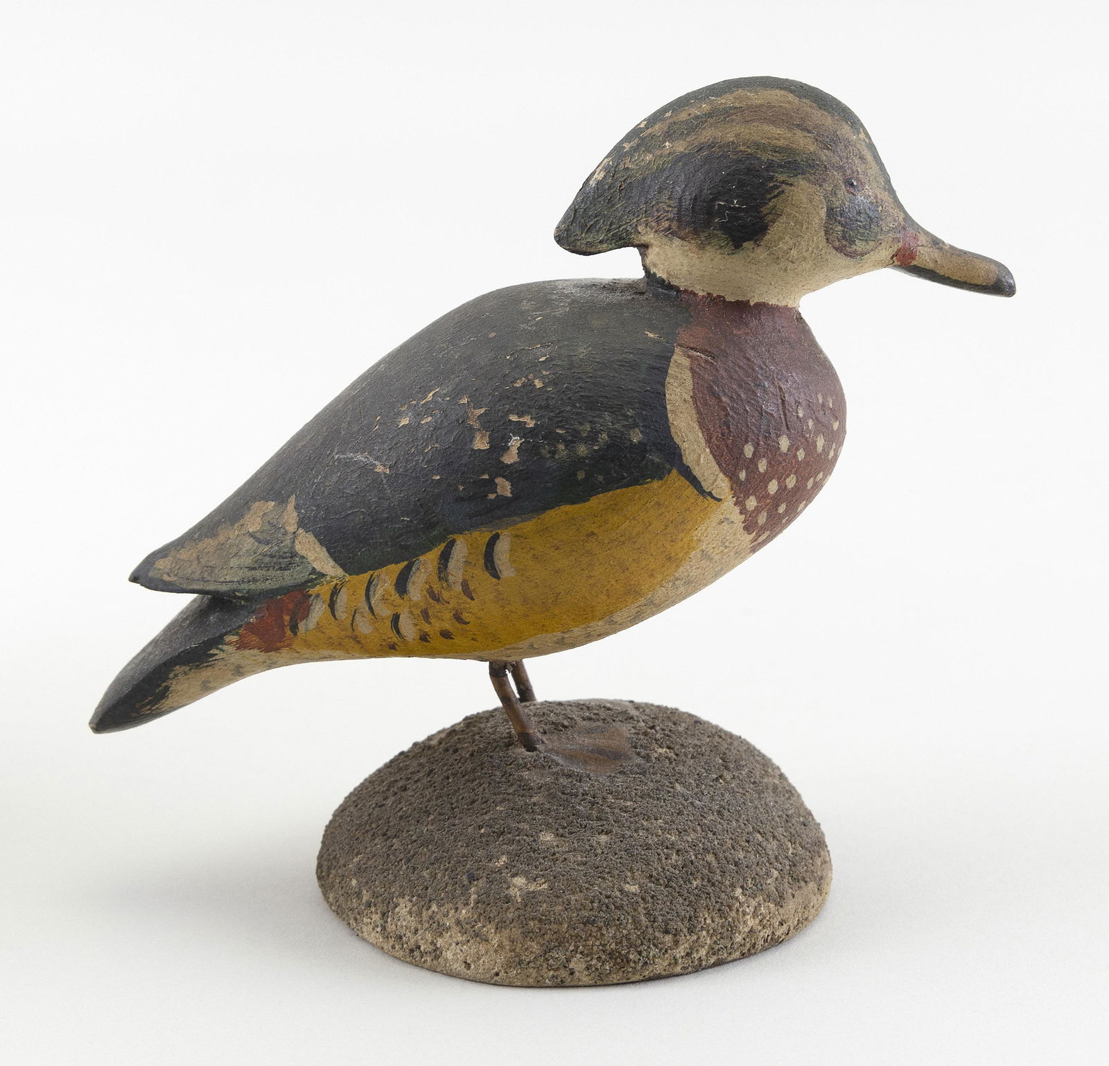 RALPH D. LAURIE MINIATURE WOOD DUCK: RALPH D. LAURIE MINIATURE WOOD DUCKHingham, Massachusetts, 20th CenturyIn standing position. Mounted on a round wooden base with sand finish.Height 4”.