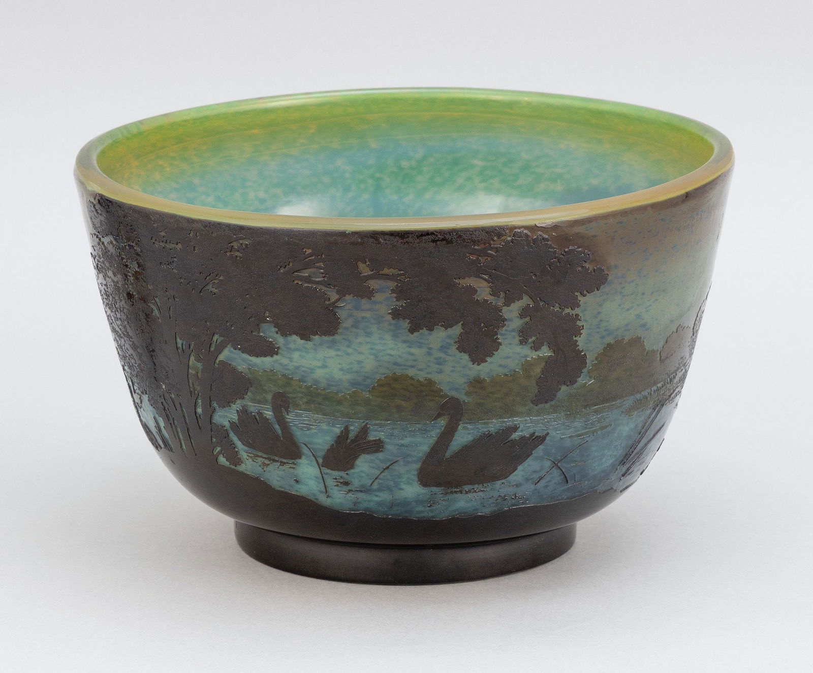GALLÉ CAMEO GLASS FOOTED BOWL Nancy, France, Late 19th: GALLÉ CAMEO GLASS FOOTED BOWL Nancy, France, Late 19th Century Depicting the shore of a lake with swans. Shades of brown, green, yellow and blue. Raised “Gallé” signature. Polished pontil. Heigh