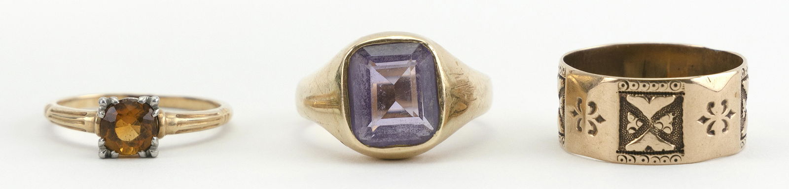 THREE 14KT GOLD RINGS 1) Set with an amethyst. Maker's (1 of 2)