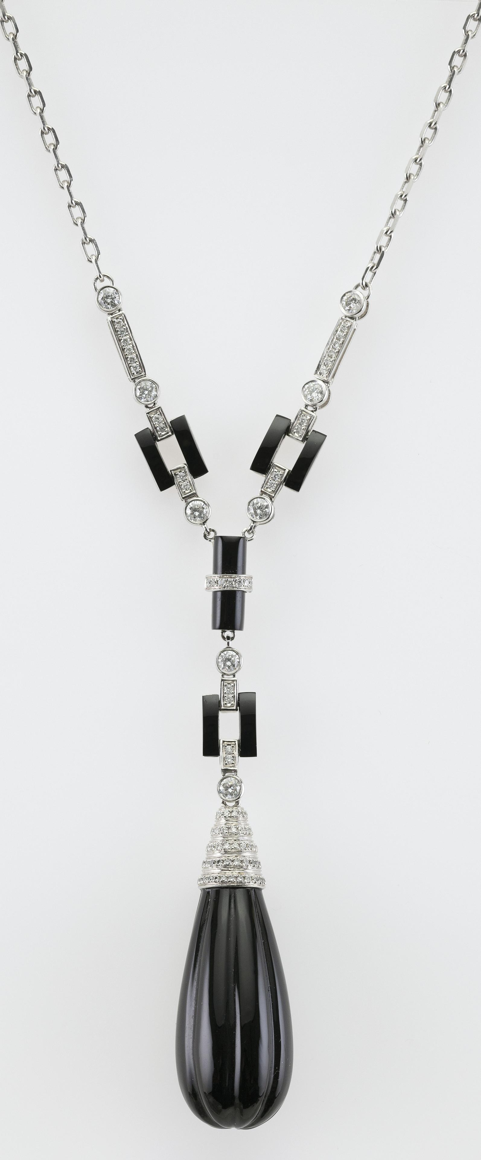 18KT WHITE GOLD, BLACK ONYX AND DIAMOND NECKLACE: 18KT WHITE GOLD, BLACK ONYX AND DIAMOND NECKLACE Contemporary Length 16”. Total diamond weight approx. 1.37 cts. Approx. 14.90 total dwt.