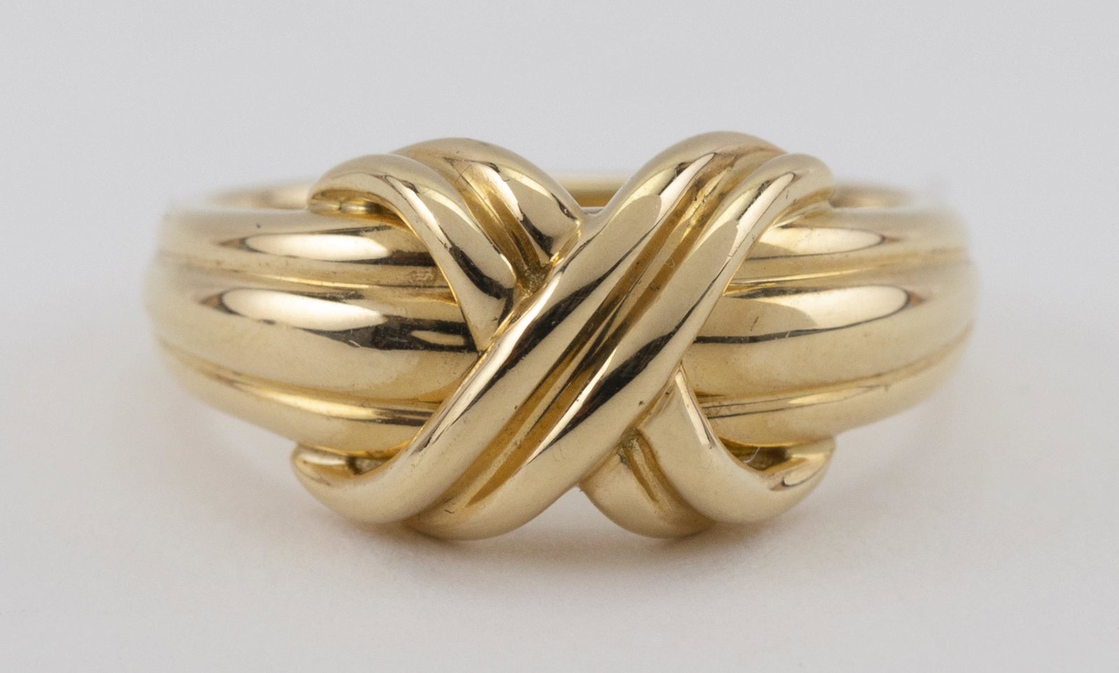 TIFFANY & CO. “SIGNATURE X” 18KT GOLD RING Copyright: TIFFANY & CO. “SIGNATURE X” 18KT GOLD RING Copyright 1990 Size 5½. Approx. 4.03 dwt.