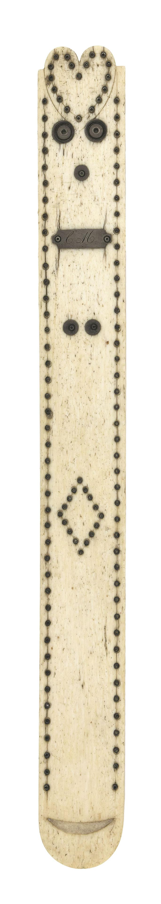WHALEBONE BUSK WITH SILVERED METAL DECORATION: WHALEBONE BUSK WITH SILVERED METAL DECORATION Mid-19th Century Top of busk carved with central heart and square corners. Heart is further formed by an engraved and studded perimeter. Similarly engrave