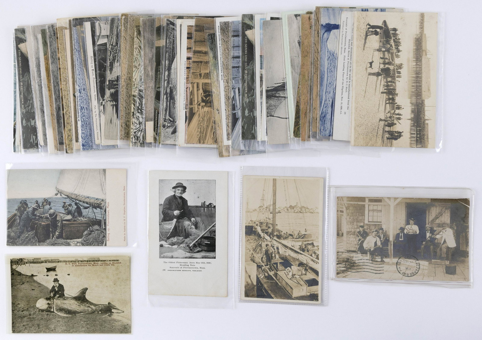 (VIEW) CAPE COD - PROVINCETOWN - FISHERMEN: 60: (VIEW) CAPE COD - PROVINCETOWN - FISHERMEN: 60 POSTCARDS Early to Mid-20th Century Real photo: beached whale in harbor, six men holding implements (square, compass, axe- possibly Masonic), fishermen o