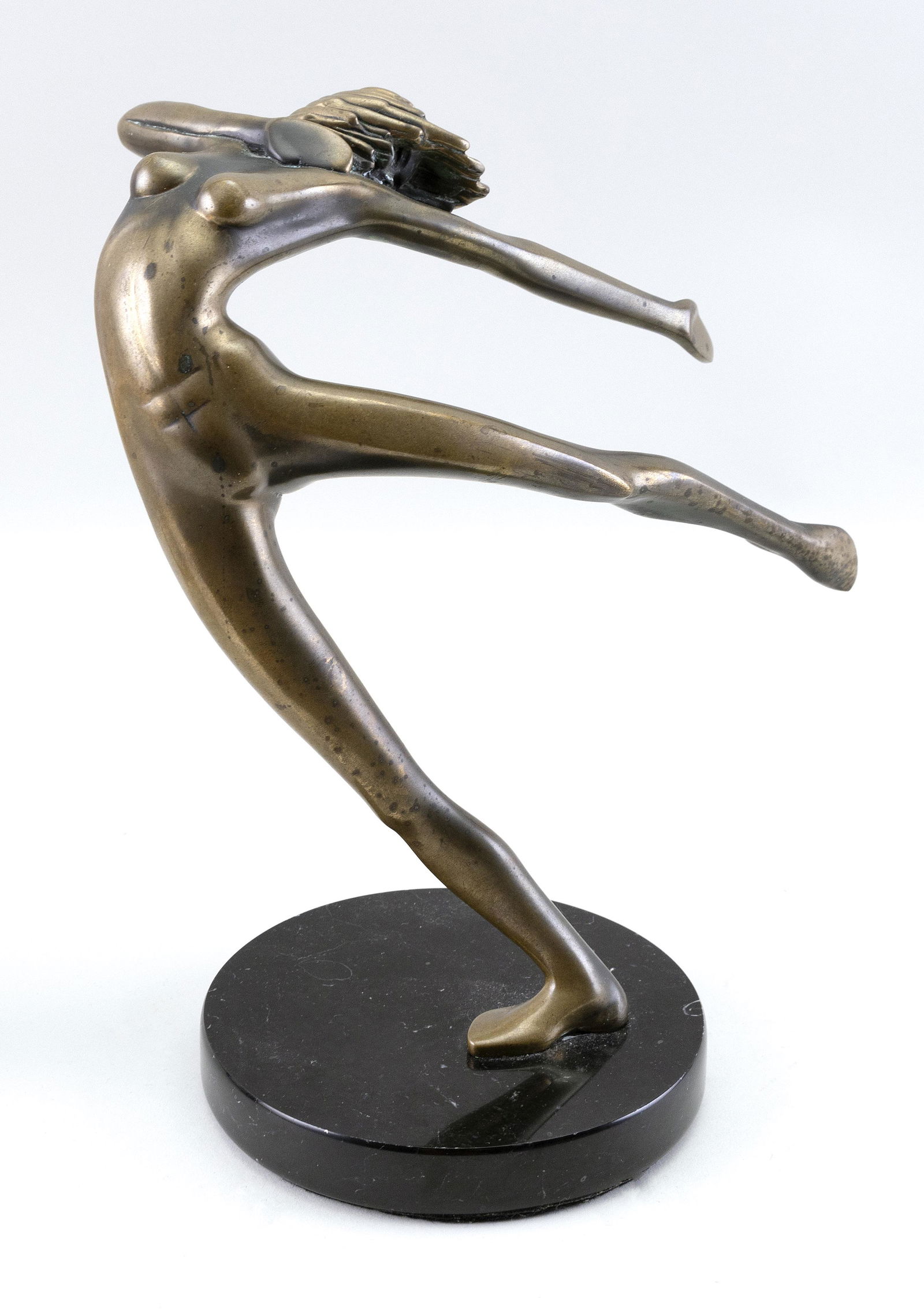 TOM BENNETT (California, b. 1928), Dancing nude.,: TOM BENNETTCalifornia, b. 1928Dancing nude. Signed and dated on foot “Tom Bennett ‘80” and numbered 89/100.Bronze on a black marble base, height 10”. Base diameter 5.25”.