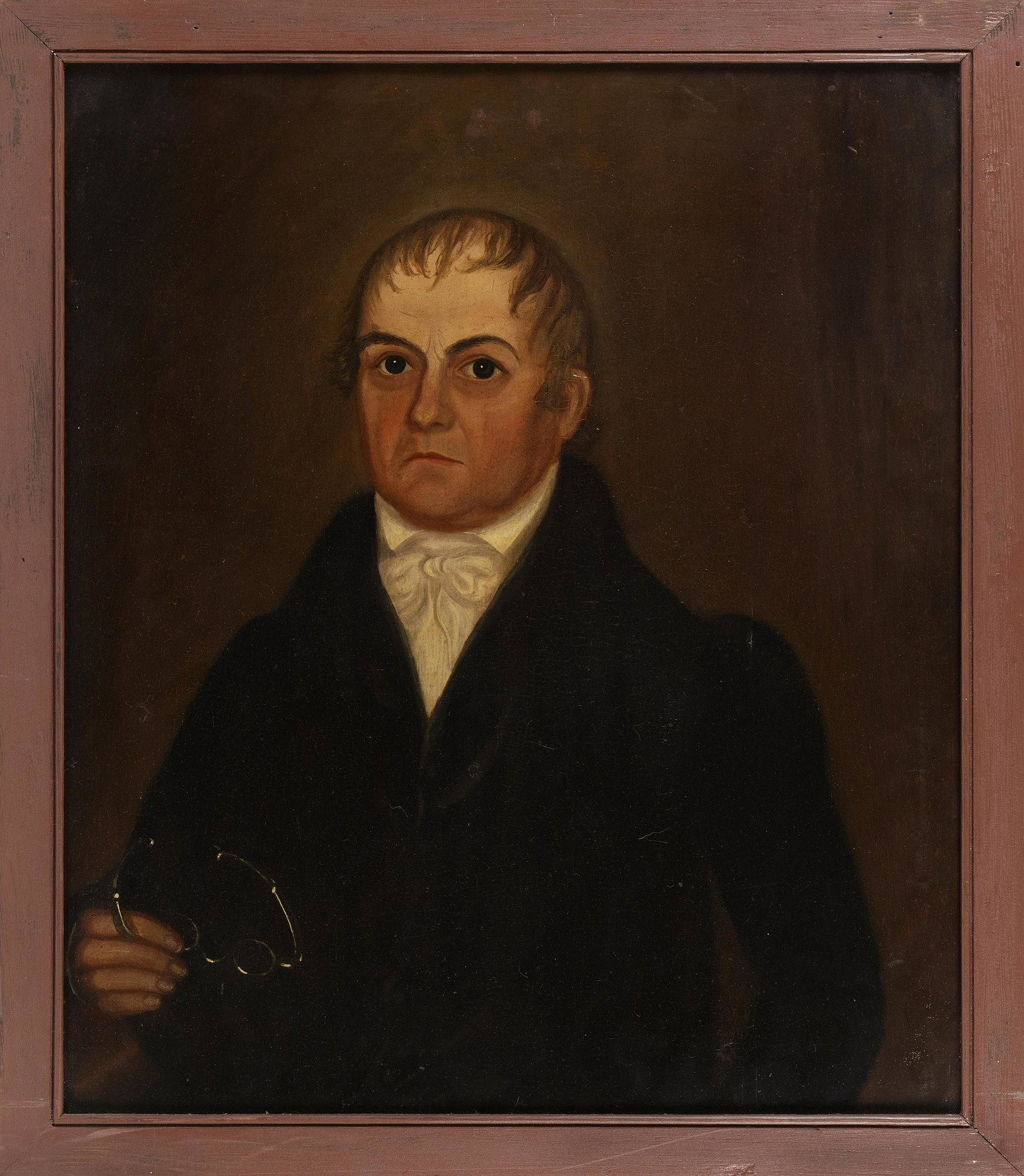 AMERICAN SCHOOL (Early 19th Century,), Portrait of a: AMERICAN SCHOOLEarly 19th CenturyPortrait of a gentleman holding a pair of reading glasses. In the manner of Ammi Phillips. Unsigned.Oil on poplar panel, 29” x 24.5”. Framed 32” x 27.5”.