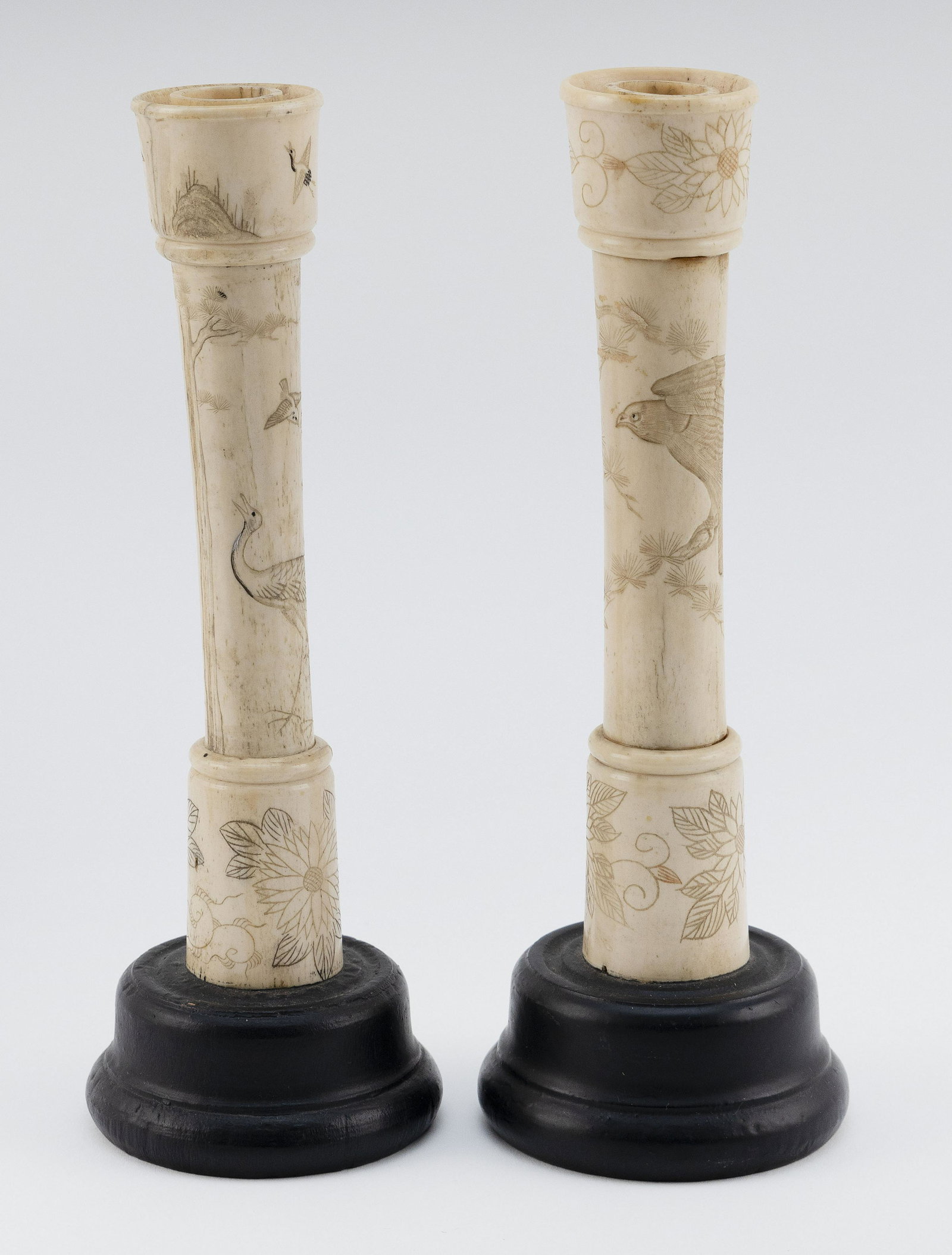 PAIR OF JAPANESE TURNED AND ENGRAVED BONE CANDLESTICKS: PAIR OF JAPANESE TURNED AND ENGRAVED BONE CANDLESTICKS Meiji Period Engraved with flowers, birds, insects, etc. Heights 9.5".