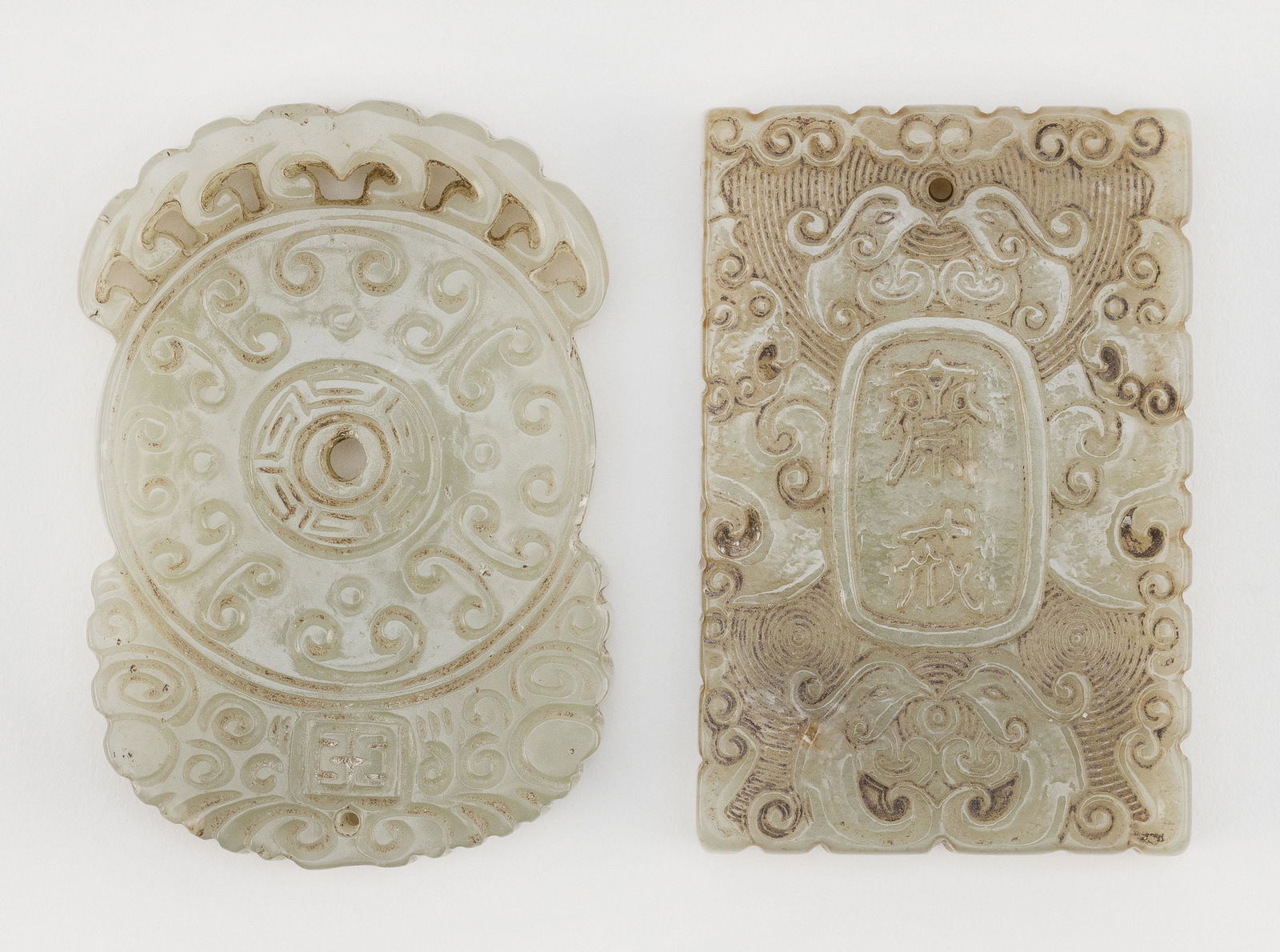 TWO CHINESE CARVED CELADON JADE PLAQUES (1 of 2)