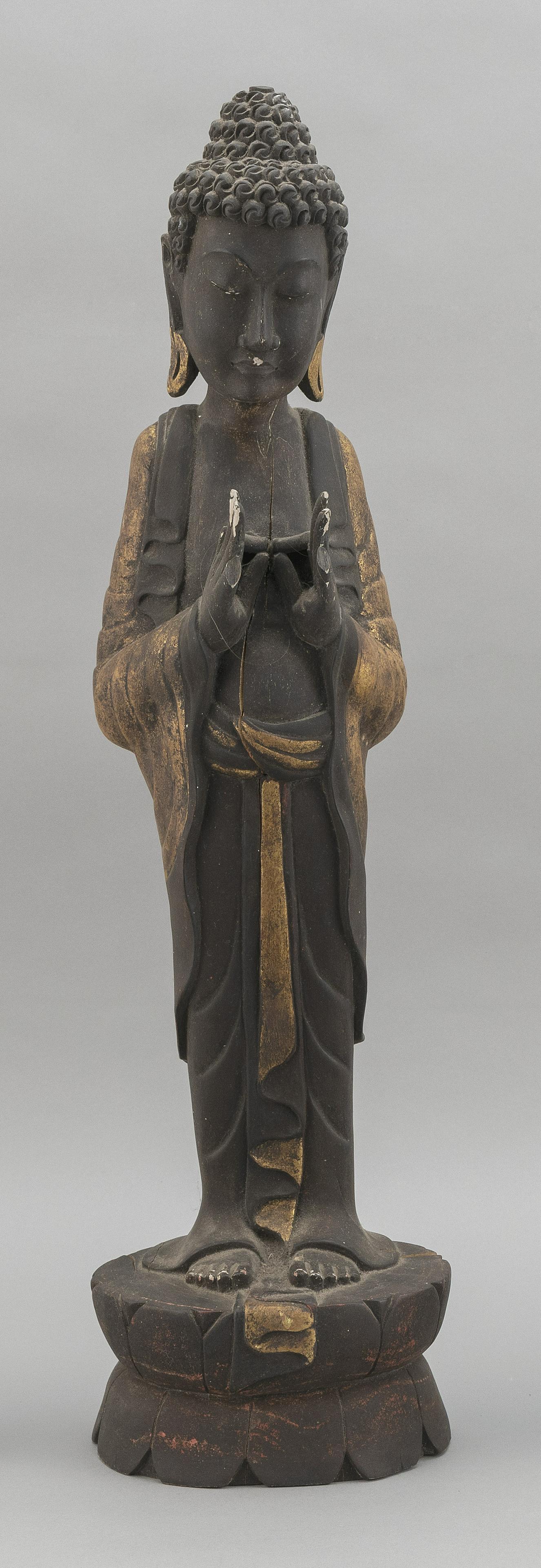 TIBETAN GILTWOOD FIGURE OF BUDDHA Early 20th Century: TIBETAN GILTWOOD FIGURE OF BUDDHA Early 20th Century Standing in prayer, with thumbs and index fingers touching, on a lotus base. Traces of red lacquer. Height 25".