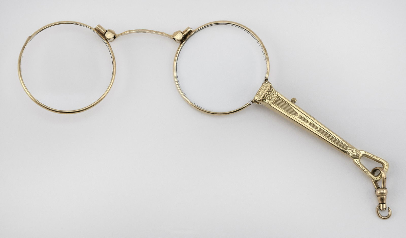14KT GOLD LORGNETTE Early 20th Century Approx. 12.68: 14KT GOLD LORGNETTEEarly 20th CenturyTogether with a gold-filled clasp. Length closed 4”.Approx. 12.68 total dwt.