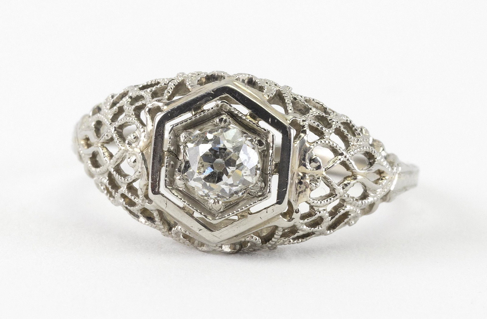 EDWARDIAN WHITE GOLD AND DIAMOND SOLITAIRE Approx. 1.48: EDWARDIAN WHITE GOLD AND DIAMOND SOLITAIRE Full-cut diamond approx. 4.0mm x 2.4mm. Size 6½. Approx. 1.48 total dwt.