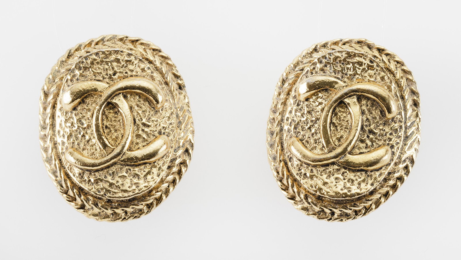 PAIR OF CHANEL COSTUME EARCLIPS: PAIR OF CHANEL COSTUME EARCLIPS Signed. Lengths 1”.