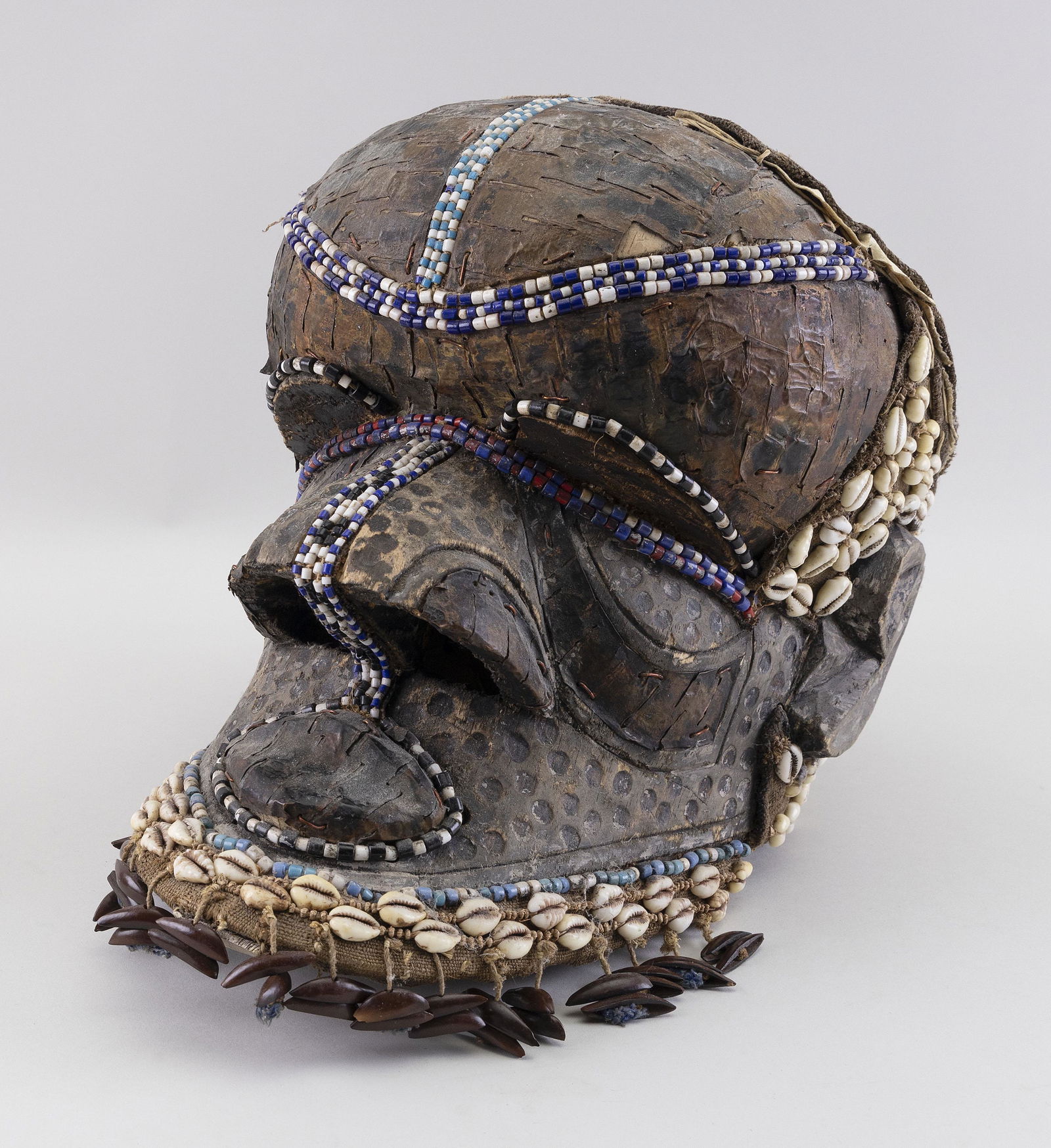 AFRICAN BEADWORK, COWRIE SHELL AND PAINTED WOOD HELMET (1 of 2)