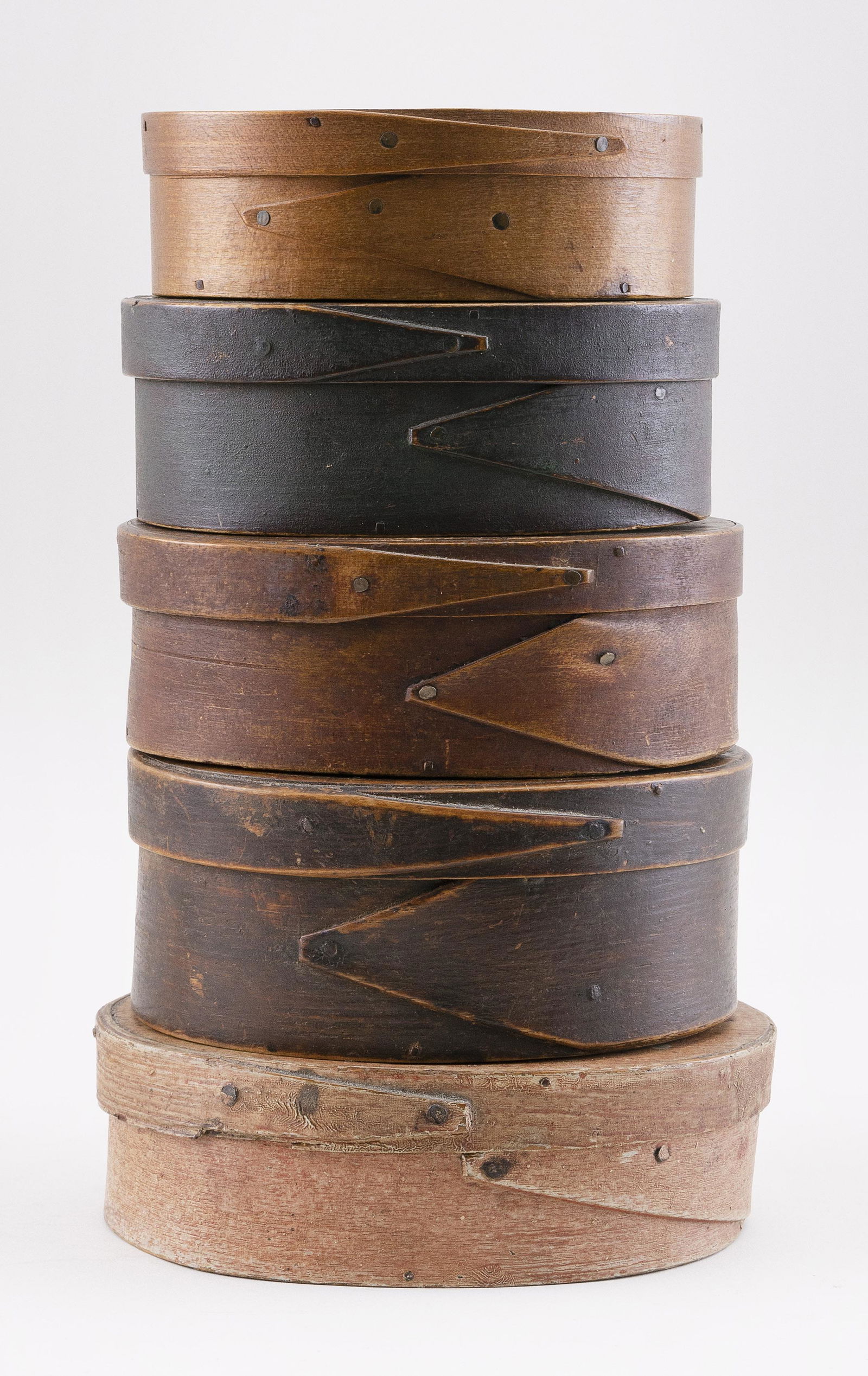 FIVE OVAL FINGER-LAPPED WOODEN BOXES Late 19th Century: FIVE OVAL FINGER-LAPPED WOODEN BOXESLate 19th CenturyFour with old painted surfaces. One with old label on lid. Lengths from 5" to 6.5".