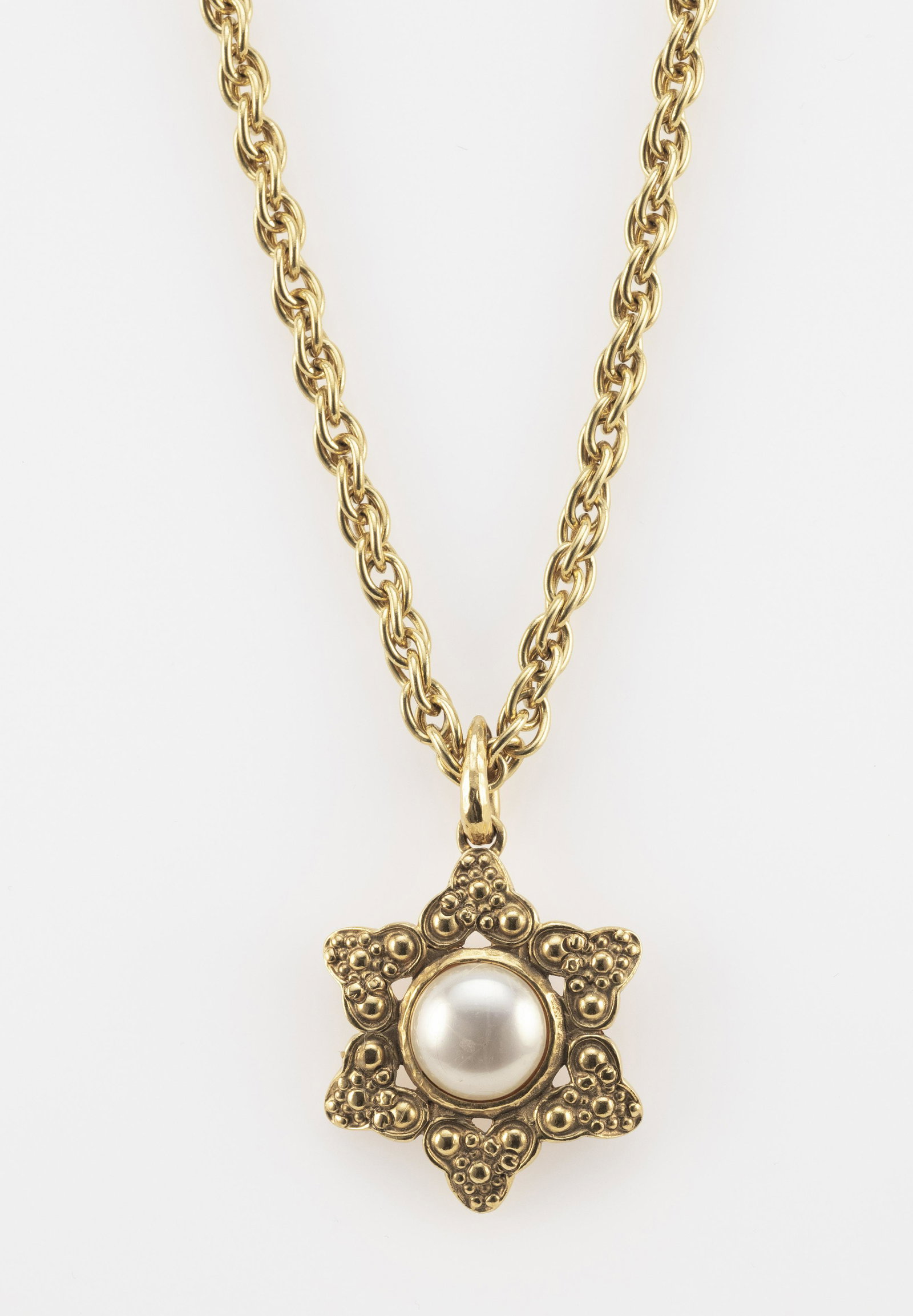 CHANEL FAUX PEARL COSTUME JEWELRY PENDANT: CHANEL FAUX PEARL COSTUME JEWELRY PENDANT On a gold-tone chain, length 21”. Pendant length 2.5”.