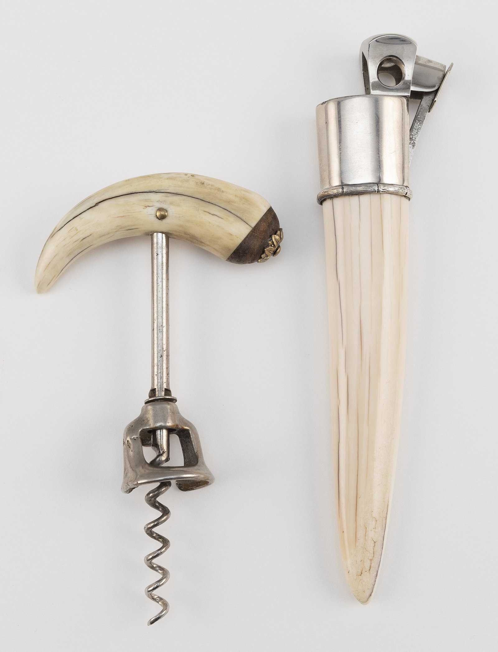 CIGAR CUTTER AND CORKSCREW Germany, Mid-20th Century: CIGAR CUTTER AND CORKSCREW Germany, Mid-20th Century The long cigar cutter in sterling silver by Blanchat Diffusion mounted on a walrus tusk handle, length 7.5". The steel corkscrew, marked "