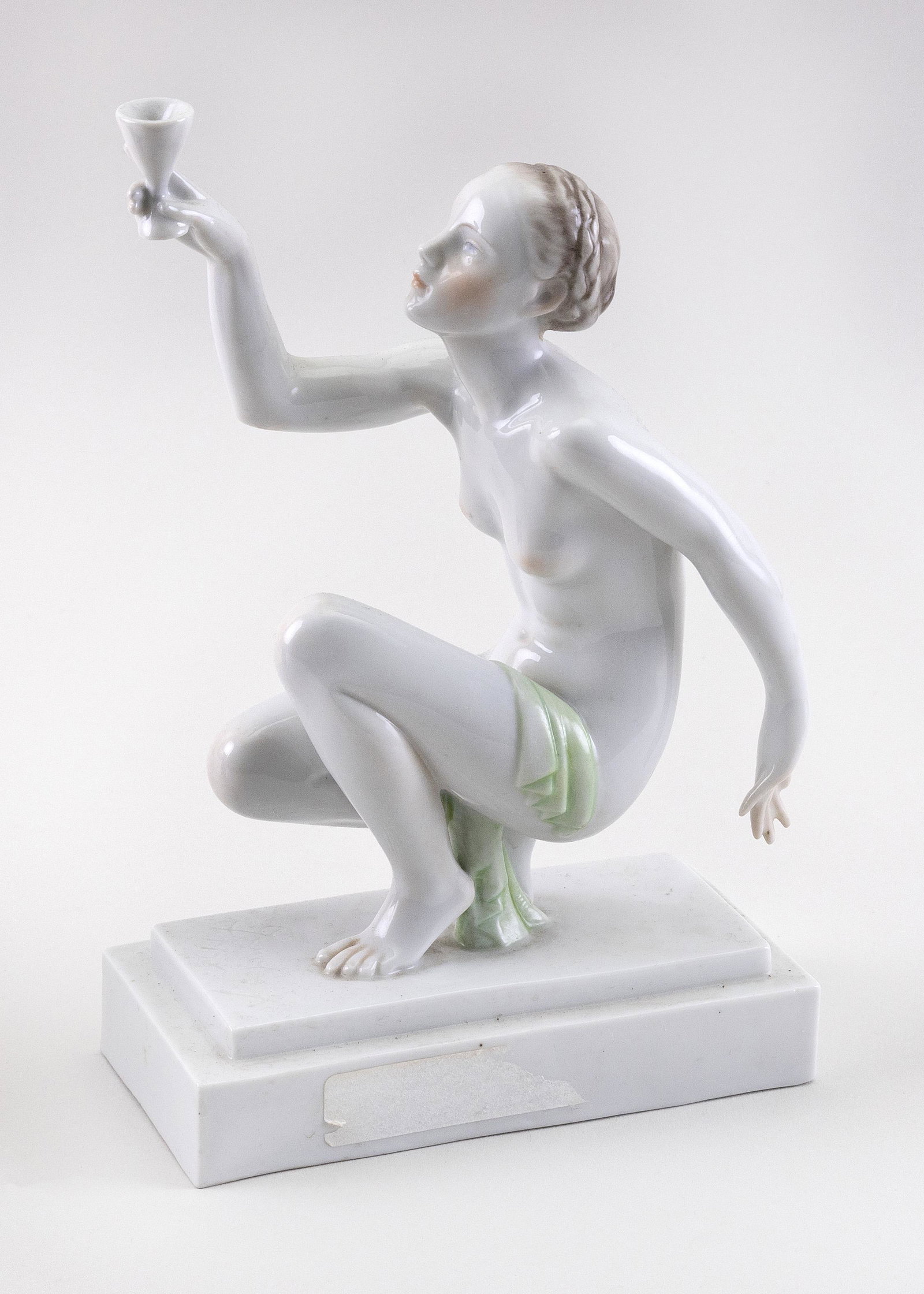 JOZSEF GONDOS FOR HEREND PORCELAIN FIGURE Height: JOZSEF GONDOS FOR HEREND PORCELAIN FIGURE A crouching nude woman holding a goblet. Stamped and impressed marks. Height 8.5”.