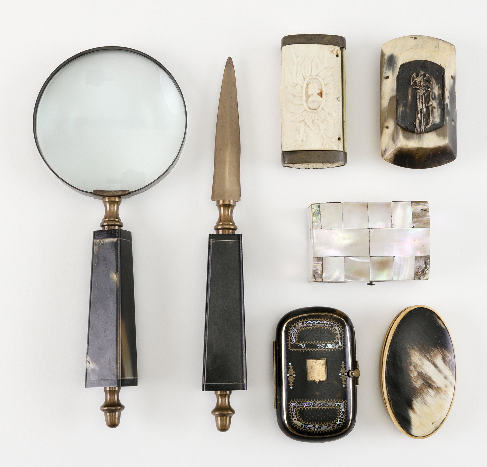 SEVEN HORN, BONE AND SHELL ITEMS: SEVEN HORN, BONE AND SHELL ITEMS 1) European brass-mounted bone box carved with figures. Length 3.25”. 2) Antique English hinged shell box inlaid with mother-of-pearl and brass. Length 3.5”