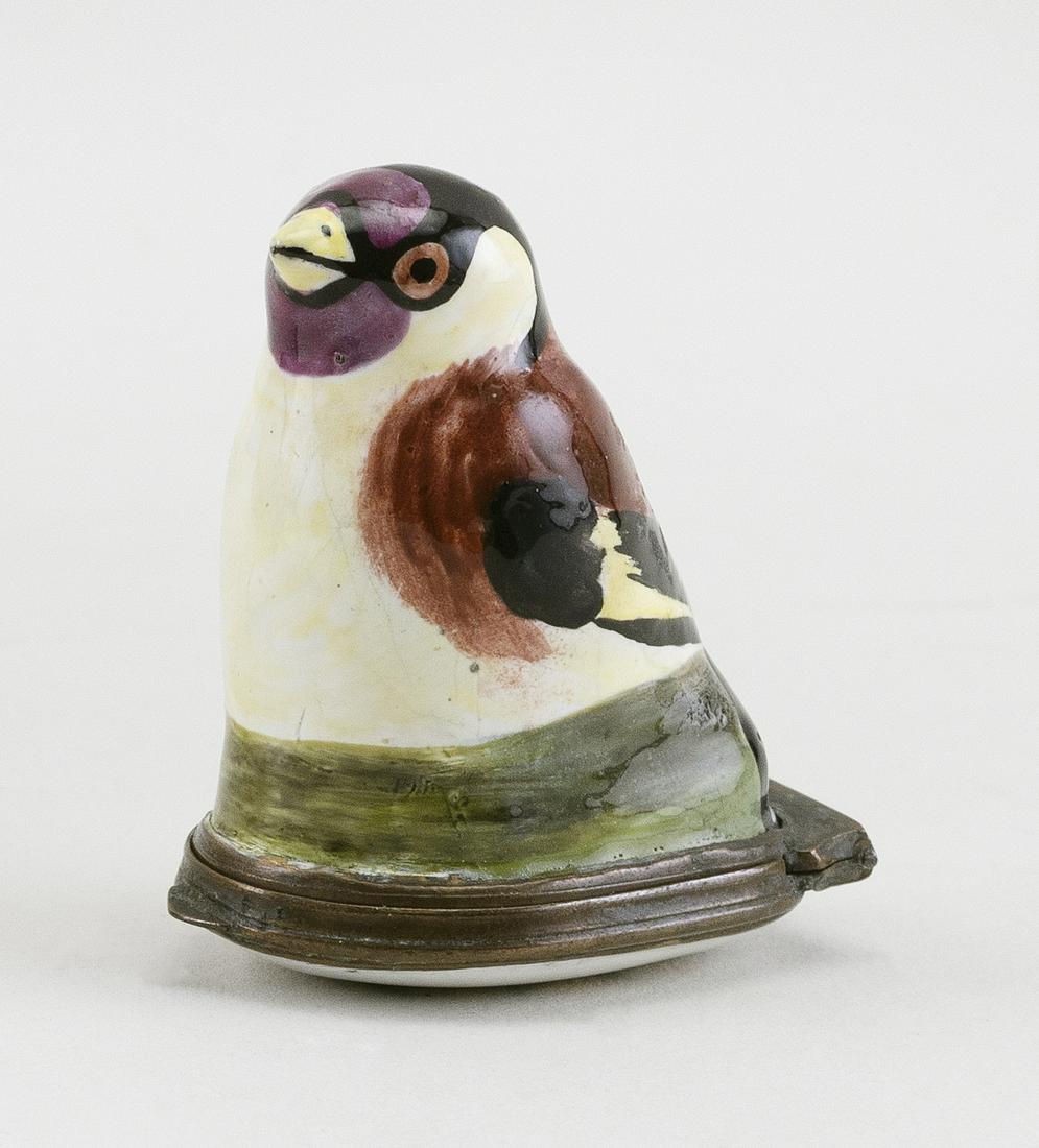 ENGLISH ENAMEL BIRD BONBONNIERE Circa 1770 Length 1.5".: ENGLISH ENAMEL BIRD BONBONNIERE Circa 1770 Seated on a green grass base. Cover painted with a flower spray. Length 1.5".