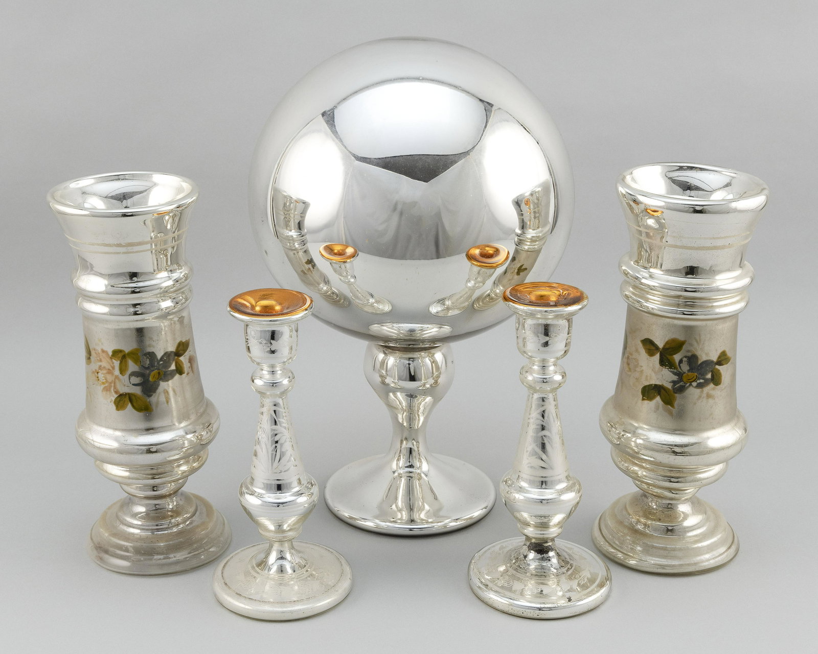 FIVE PIECES OF ENGLISH MERCURY GLASS 19th Century: FIVE PIECES OF ENGLISH MERCURY GLASS 19th Century A centerpiece ball on pedestal, height 15.5”, a pair of engraved candlesticks, heights 9”, and a pair of floral-decorated vases.
