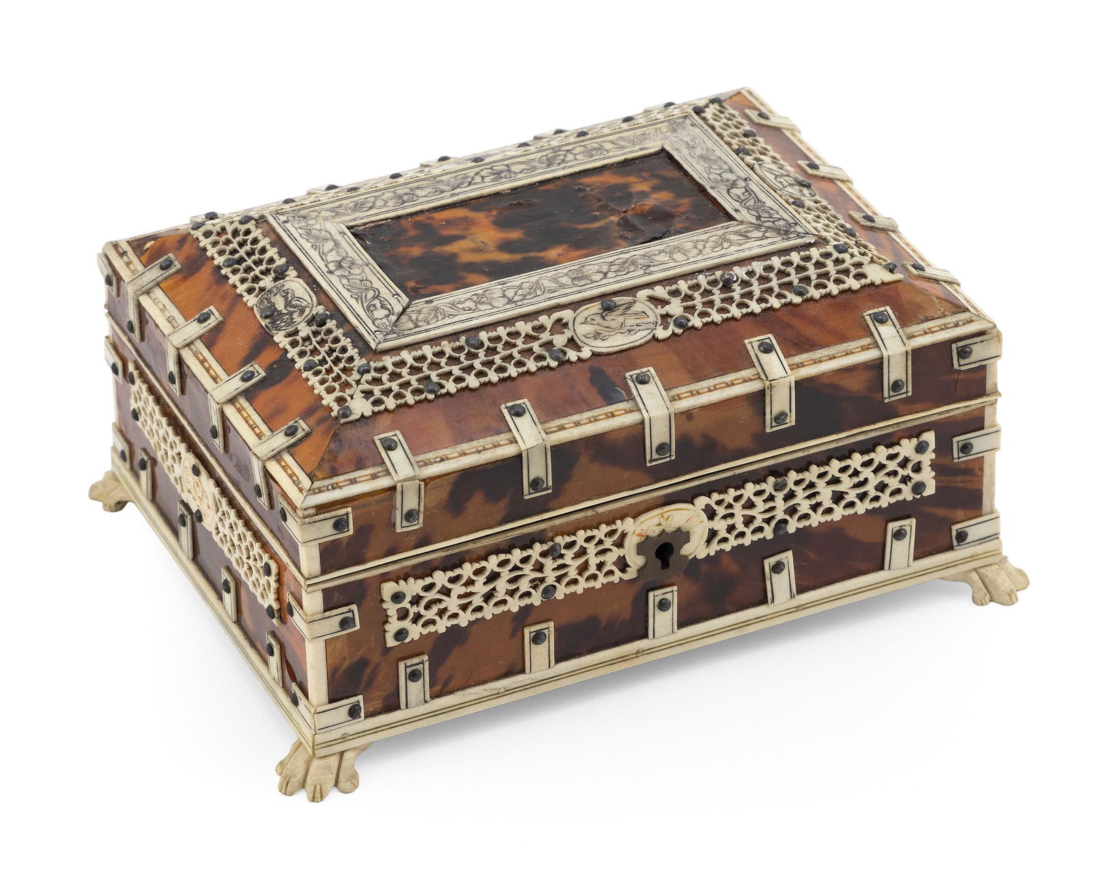 BONE AND SHELL SEWING BOX 19th Century Height 3.25".: BONE AND SHELL SEWING BOX19th CenturyPossibly prisoner-of-war. Wood body with shell veneer and bone trim applied with metal rivets. Hinged mansard lid with central shell panel surrounded by two bone b
