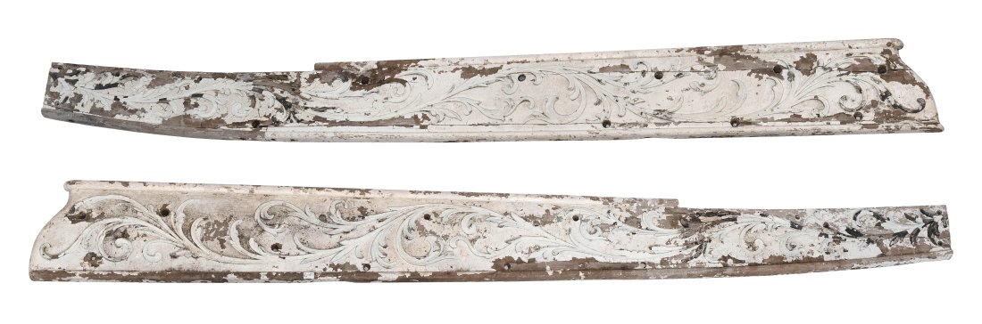 PAIR OF RELIEF-CARVED TRAILBOARDS 19th/Early 20th: PAIR OF RELIEF-CARVED TRAILBOARDS 19th/Early 20th Century Under old white paint. Foliate carvings. Approx. 14.75" x 143”.
