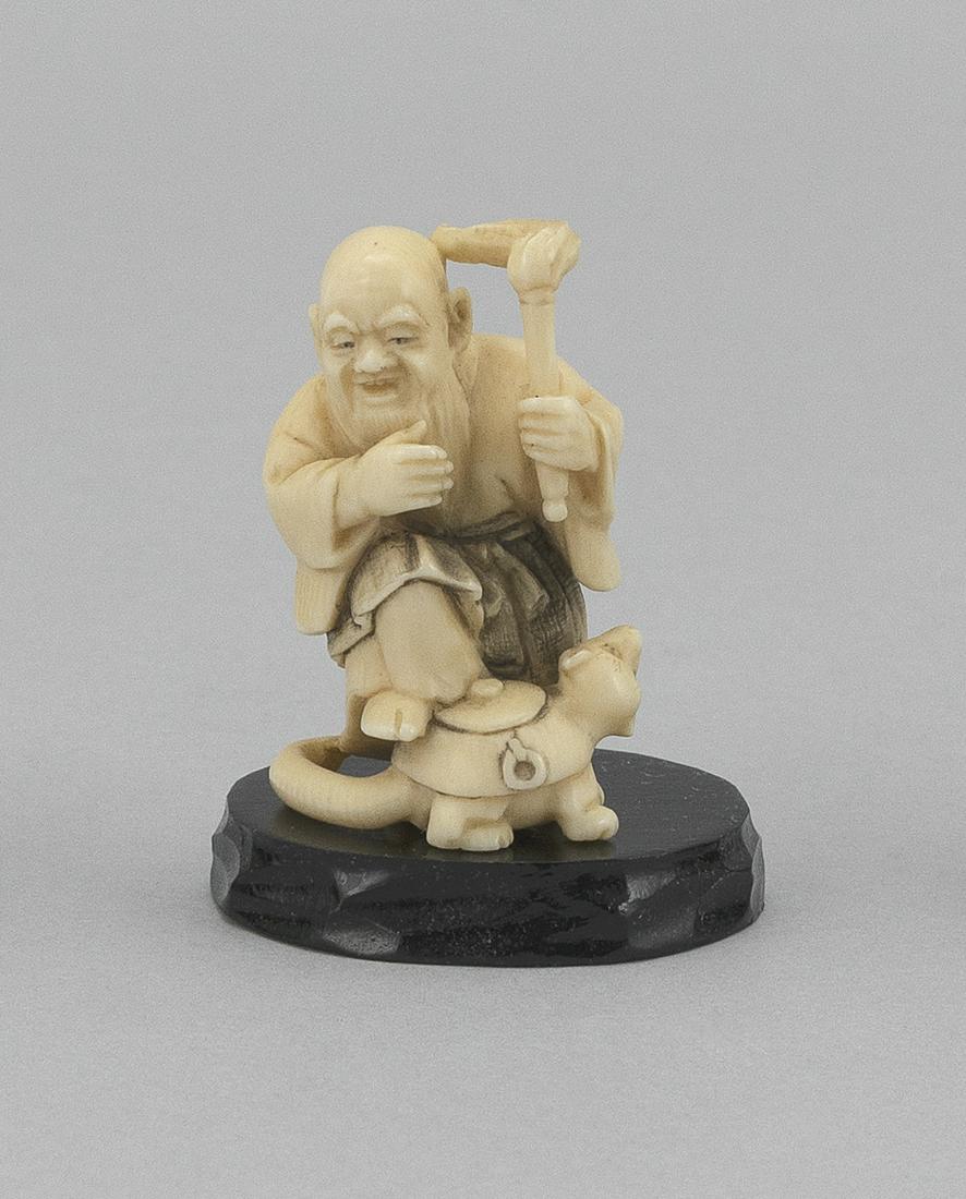 JAPANESE NETSUKE Early 20th Century Height 2.25".: JAPANESE NETSUKE Early 20th Century Priest Shukaku and his raccoon-dog tea kettle, Bunbuku. Signed "Shozan". Height 2.25". Provenance: Private Collection, San Antonio, Texas.