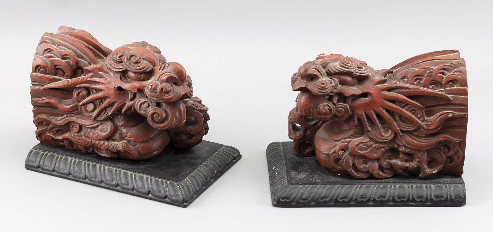 PAIR OF CHINESE RED LACQUERED WOOD QILIN HEADS Late 19th Century Heights 6”. Lengths 8”. (1 of 2)