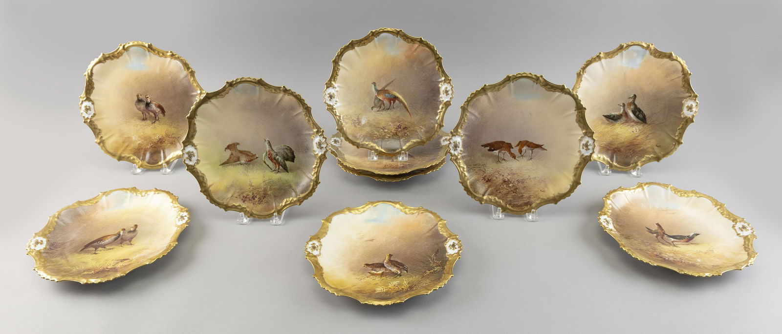 SET OF TEN LIMOGES HAND-PAINTED PORCELAIN PLATES France, Early 20th Century (1 of 2)