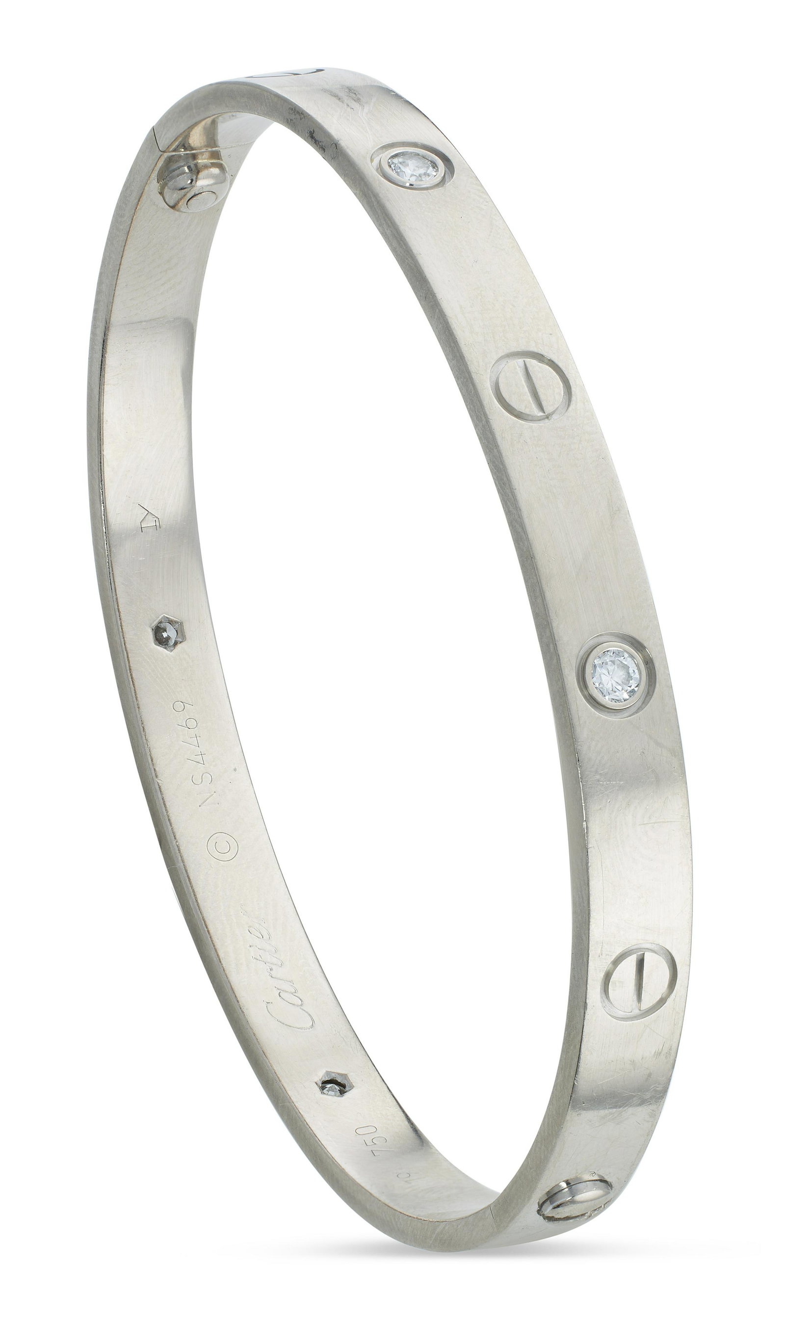 CARTIER LOVE BRACELET IN 18KT GOLD: CARTIER LOVE BRACELET IN 18KT GOLD (NO RESERVE*) Approx. 23.36 dwt. (* To be sold with no reserve above starting bid). Approx. 6mm width. Bracelet is set with four brilliant cut diamonds approx. 0.40 