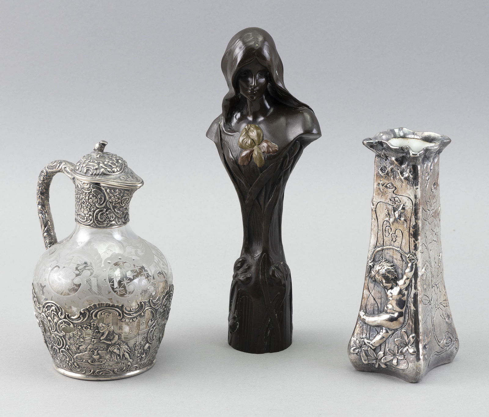 THREE EUROPEAN DECORATIVE OBJECTS Late 19th/Early 20th Century: THREE EUROPEAN DECORATIVE OBJECTSLate 19th/Early 20th Century1) Dutch silver and engraved glass claret jug with hinged lid. Hallmarked on base. Height 5.75".2) Bronze-finish Art Nouveau bust sign