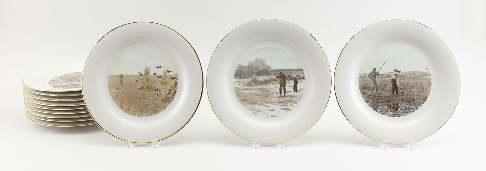 SET OF TWELVE A.B. FROST TRANSFER-DECORATED PORCELAIN PLATES Circa 1960 Diameters 11”. (1 of 2)