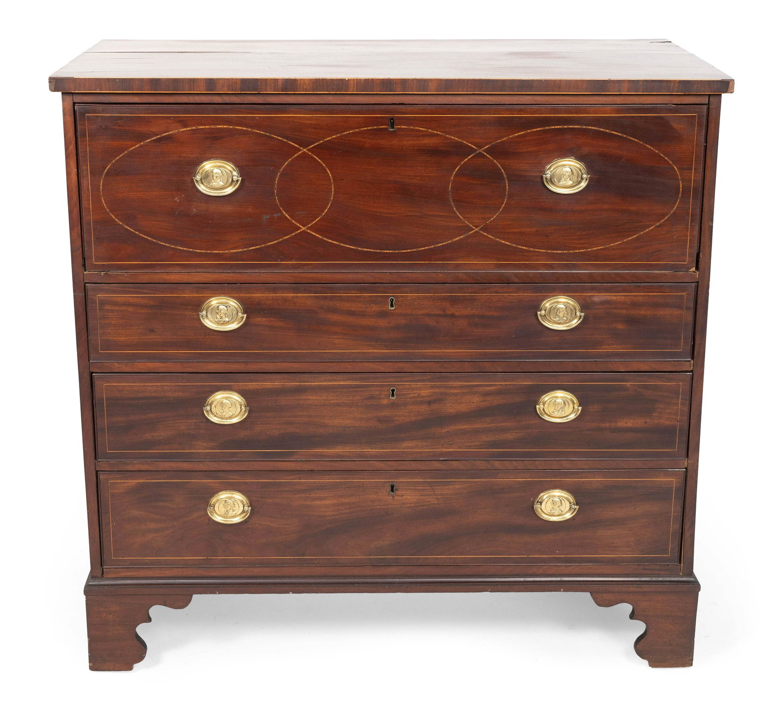 ENGLISH BUTLER'S SECRETARY Late 18th Century Height 46”. Width 48". Depth 24”.: ENGLISH BUTLER'S SECRETARY Late 18th Century In mahogany and mahogany veneer with fruitwood string inlay. Fold-down top drawer conceals a fitted interior. Three full-width drawers below. Shaped bracke