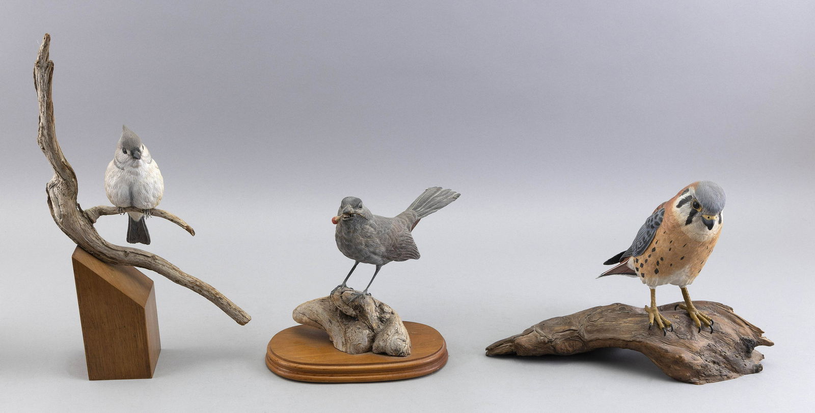 THREE LIFE-SIZE DECORATIVE BIRD CARVINGS Late 20th Century Heights from 8” to 14”. (1 of 4)