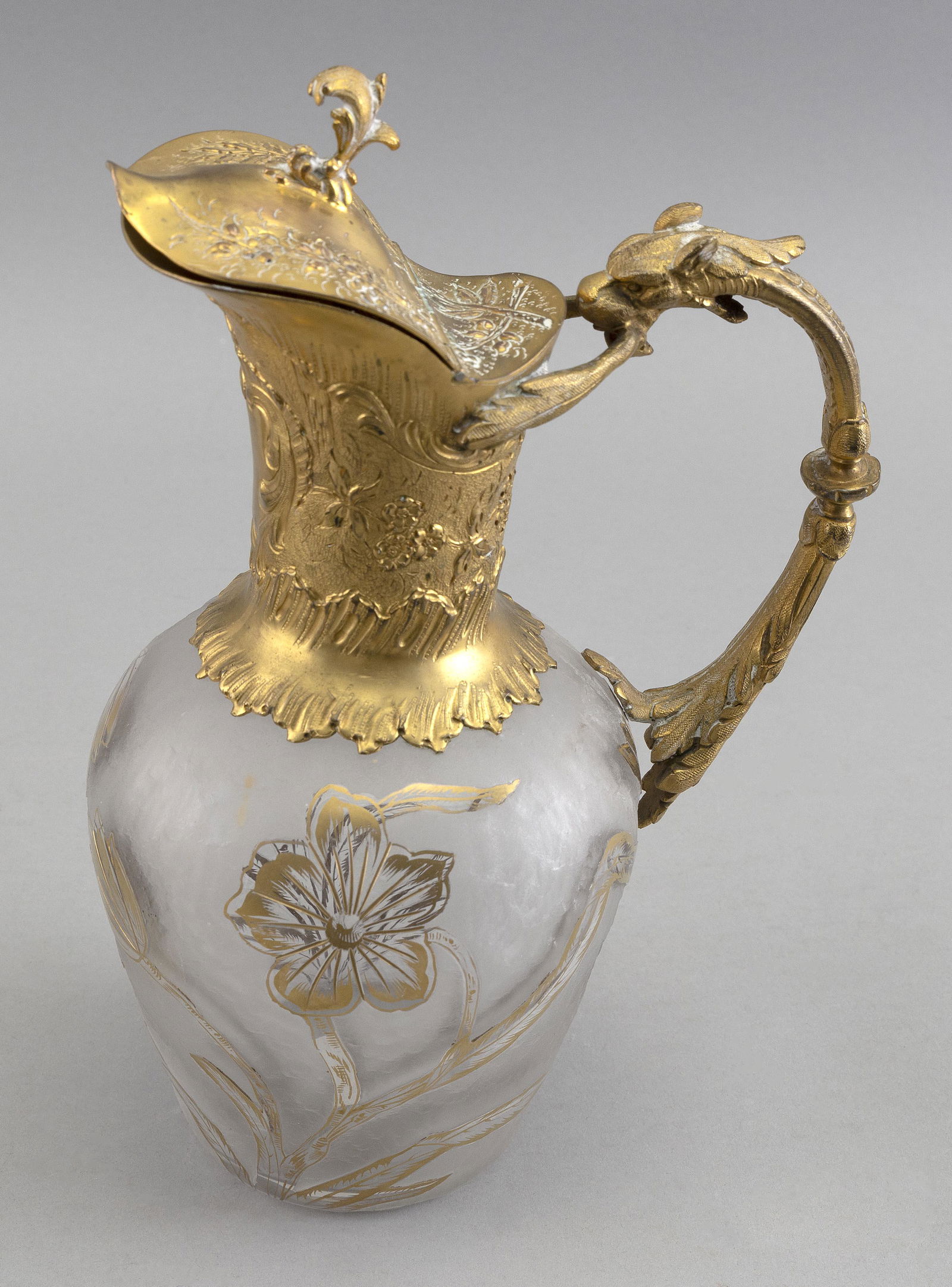 ORMOLU AND CARVED GLASS EWER ATTRIBUTED TO THOMAS WEBB England, 19th Century Height 10”.: ORMOLU AND CARVED GLASS EWER ATTRIBUTED TO THOMAS WEBBEngland, 19th CenturyHeight 10”.