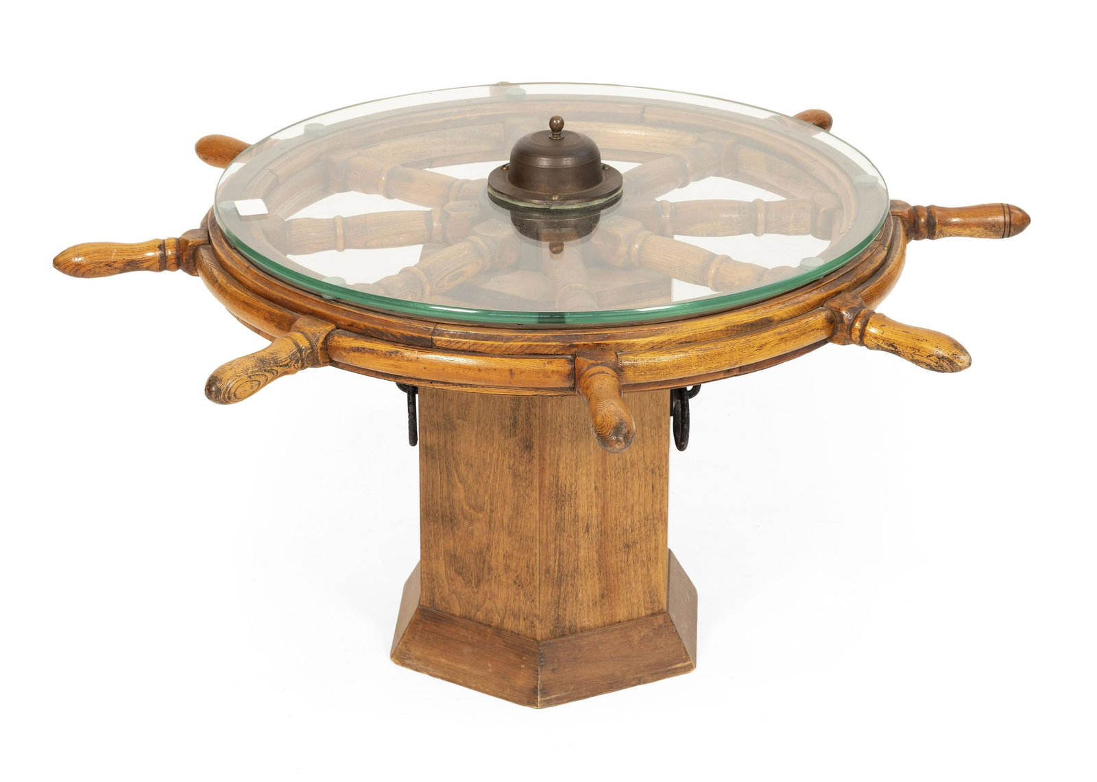 SHIP’S WHEEL TABLE 20th Century Height 20”. Diameter 35”.: SHIP’S WHEEL TABLE 20th Century Glass top. Octagonal wooden base. Height 20”. Diameter 35”.