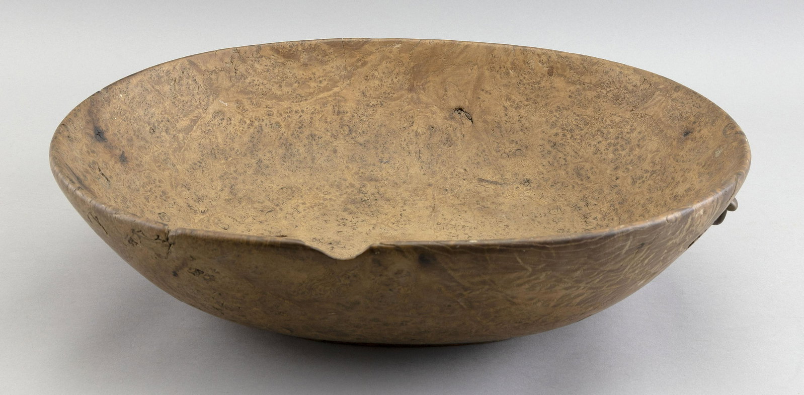 OVAL BURLED MAPLE BOWL Circa 1780 Height 4.5". Length 16.5". Width 13".: OVAL BURLED MAPLE BOWL Circa 1780 Bail handle at one end. Shaped footed base. Wonderful old bleached finish. Height 4.5". Length 16.5". Width 13".