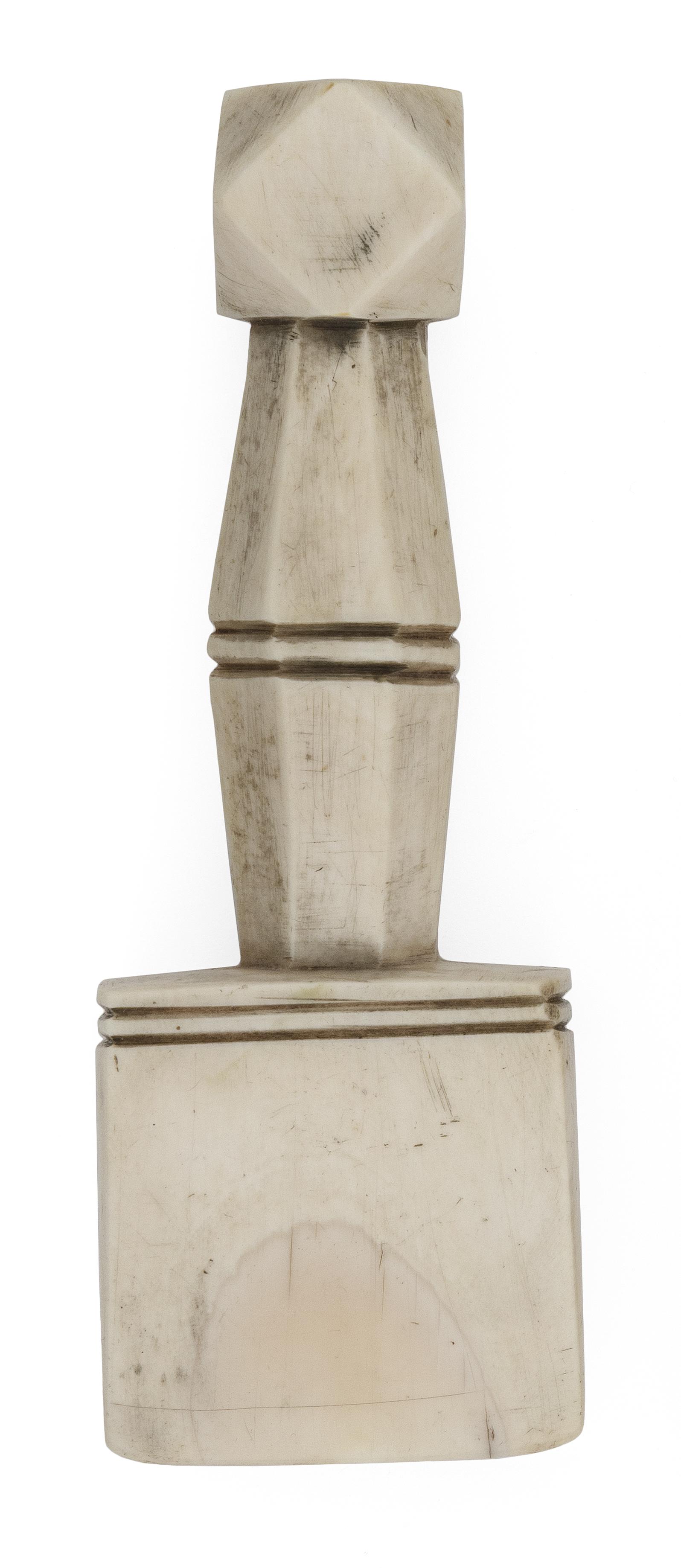 CARVED WHALE IVORY SEAM RUBBER Mid-19th Century Length 4.75".: CARVED WHALE IVORY SEAM RUBBER Mid-19th Century Faceted knop. Octagonal handle and wedge-shaped blade with deeply incised banding. Some pearling. Length 4.75".
