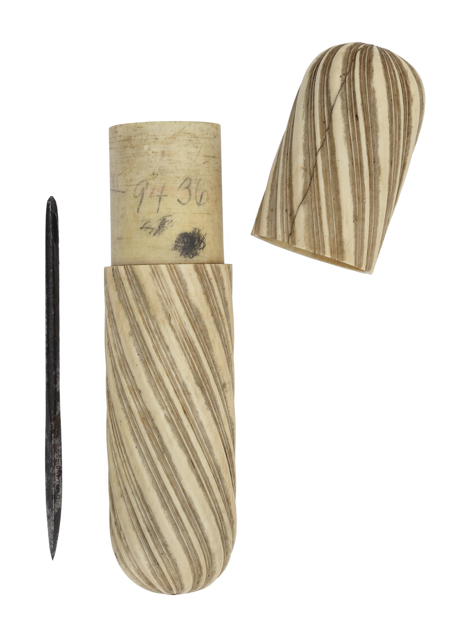 CARVED WHALE IVORY NEEDLE CASE 19th Century Length 6.25".: CARVED WHALE IVORY NEEDLE CASE 19th Century Spiraling ribbed carvings. Contains a large needle marked "A. Shrimpton. 7". Length 6.25".