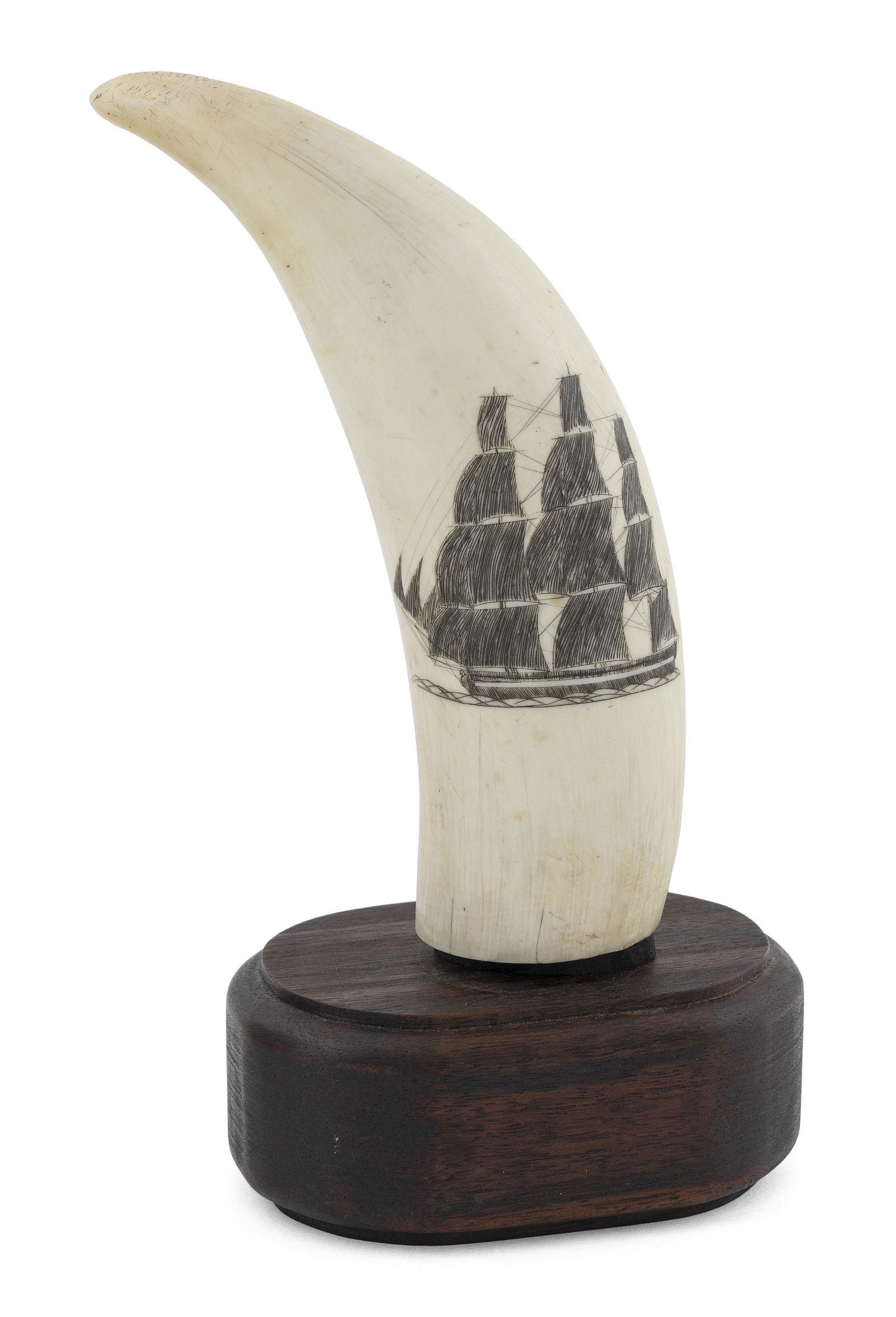 SCRIMSHAW WHALE'S TOOTH WITH CLIPPER SHIP AND WHALING SCENES Mid-19th Century Length 6". Includes: SCRIMSHAW WHALE'S TOOTH WITH CLIPPER SHIP AND WHALING SCENESMid-19th CenturyObverse depicts a clipper ship under sail, the water executed in a rope-like pattern. Reverse depicts a whaling scene in two