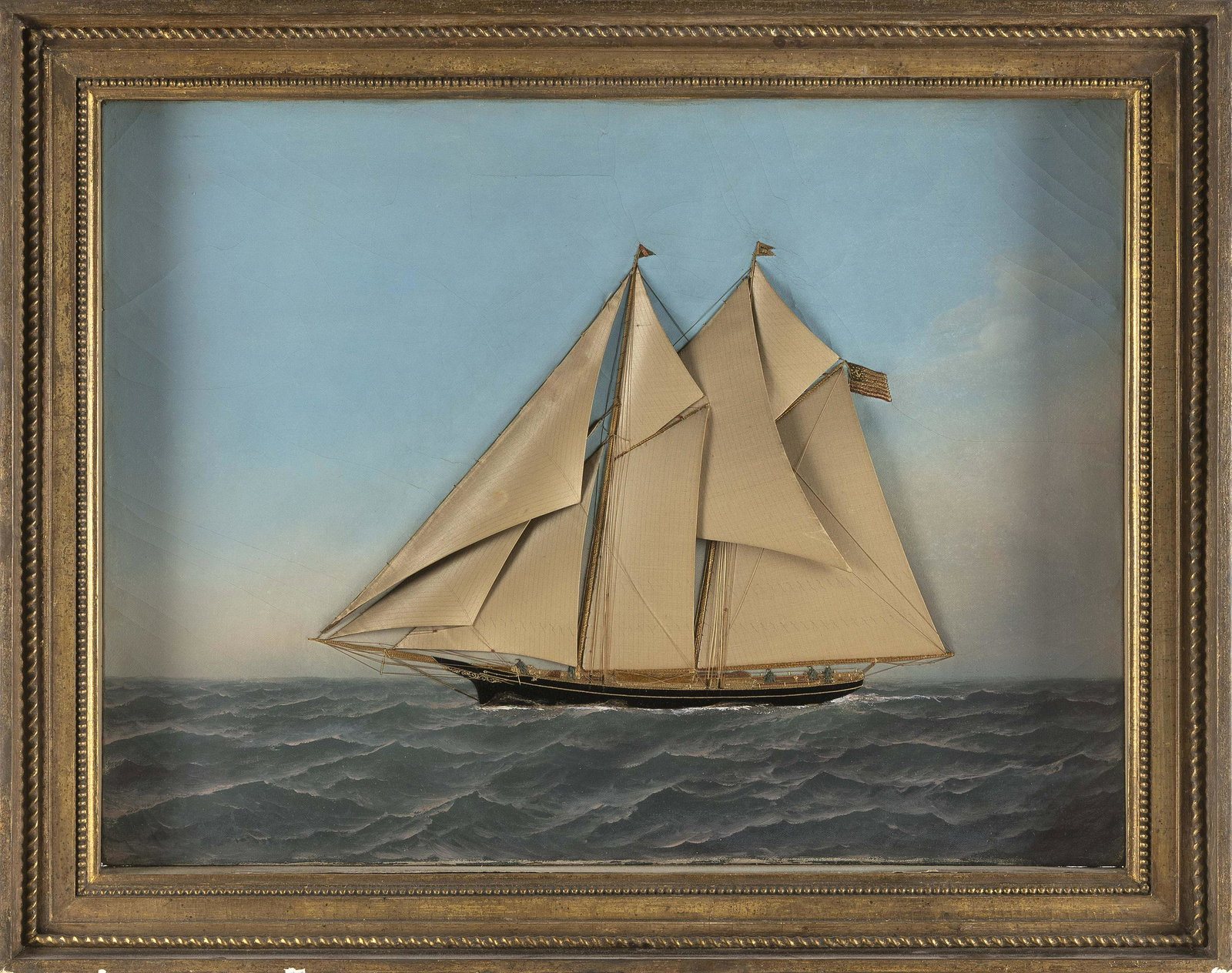 ATTRIBUTED TO ANTONIO JACOBSEN AND T. WILLIS (America/Denmark, 1850-1921 and 1850-1925), Circa 1885: ATTRIBUTED TO ANTONIO JACOBSEN AND T. WILLISAmerica/Denmark, 1850-1921 and 1850-1925Circa 1885 portrait of a schooner yacht at sea flying two burgees and an American ensign. Unsigned, but background b