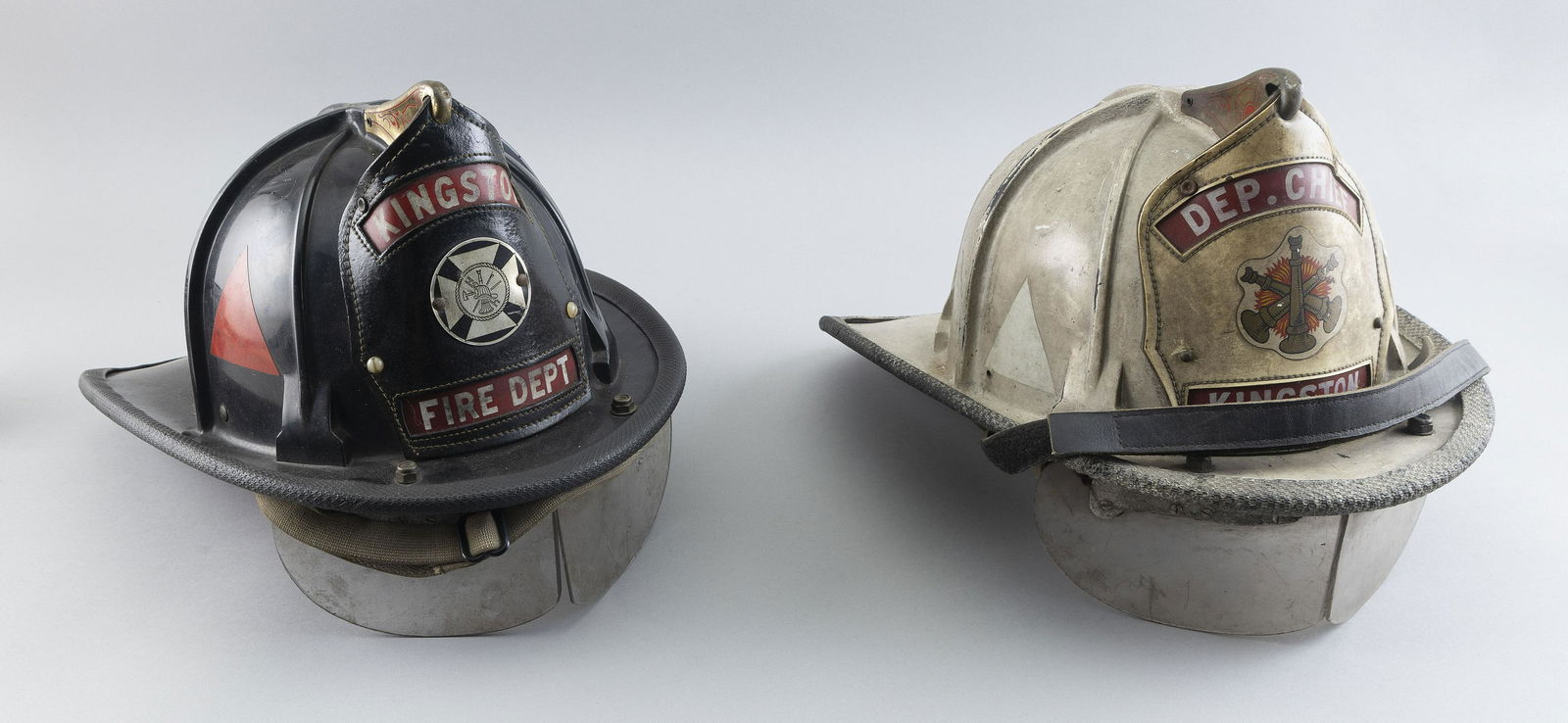 TWO KINGSTON FIRE DEPARTMENT HELMETS Late 20th Century Lengths 15.5”. (1 of 2)