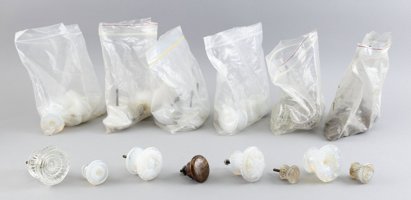 APPROX. THIRTY-SEVEN FURNITURE DRAWER PULLS: APPROX. THIRTY-SEVEN FURNITURE DRAWER PULLS Twenty-one Sandwich Glass fiery opalescent, eight clear glass and eight brown ceramic.