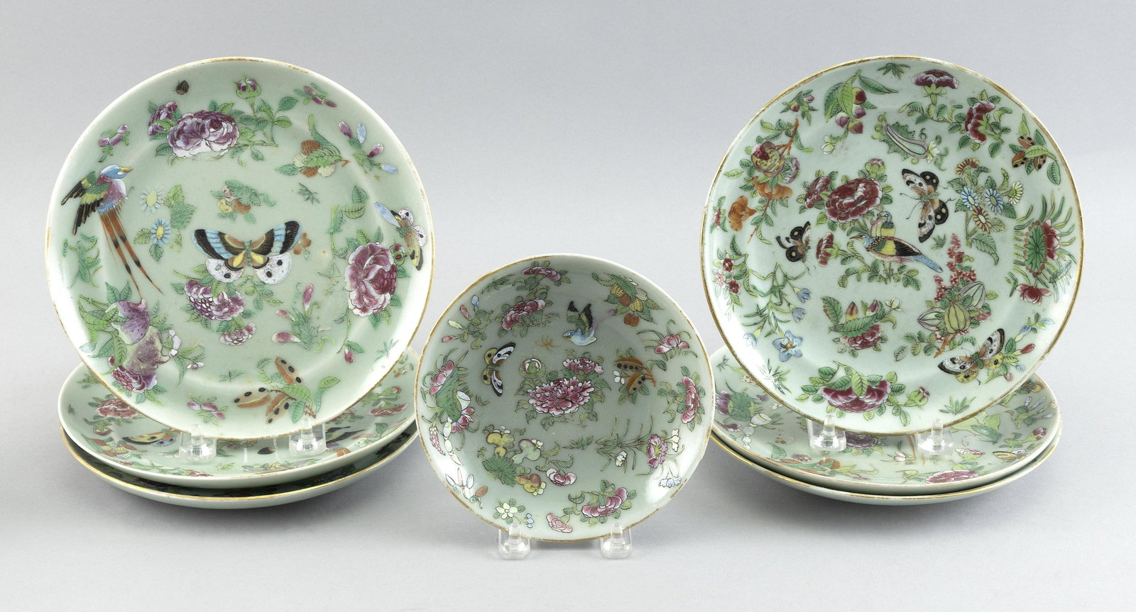 SET OF SEVEN CHINESE CELADON PORCELAIN PLATES 19th Century Diameters 5.75” and 7.75”.: SET OF SEVEN CHINESE CELADON PORCELAIN PLATES19th CenturyButterfly decoration.Diameters 5.75” and 7.75”.