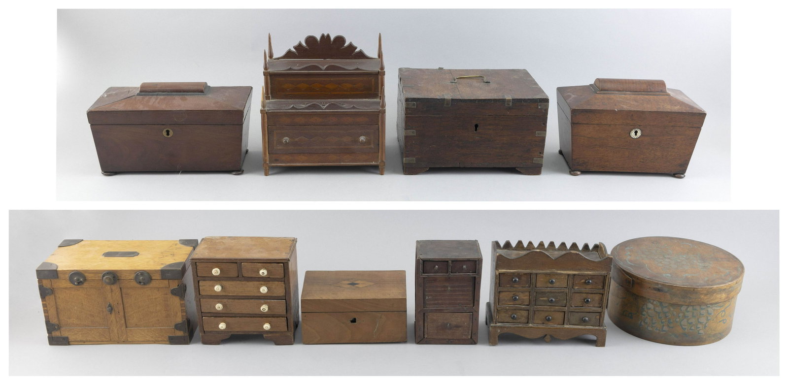 TEN WOODEN BOXES 19th and Early 20th Century Largest tea caddy height 6”. Width 10”.: TEN WOODEN BOXES 19th and Early 20th Century Two tea caddies, four doll’s chests, a round pantry box and three dresser boxes. Largest tea caddy height 6”. Width 10”. Depth 5.25”