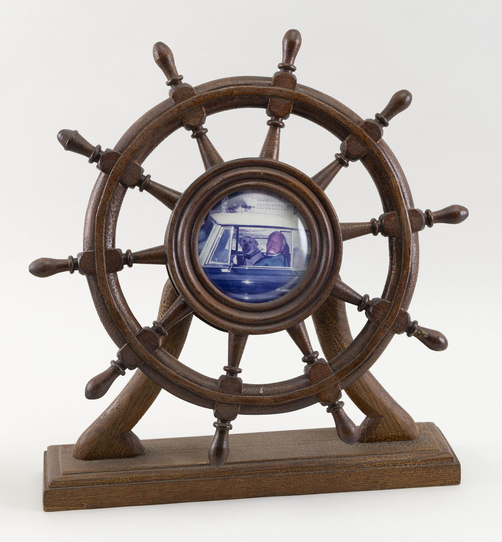 CARVED WALNUT SHIP'S WHEEL PICTURE FRAME First Half of the 20th Century Total height 15.75". Width: CARVED WALNUT SHIP'S WHEEL PICTURE FRAME First Half of the 20th Century Total height 15.75". Width 14.5".