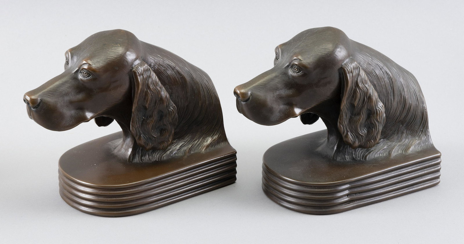 PAIR OF BRONZE SETTER-FORM BOOKENDS Circa 1920 Heights 6.5". Lengths 7.5". (1 of 2)