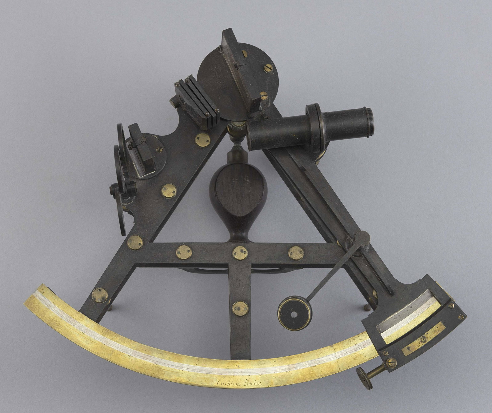 DOUBLE FRAME SEXTANT BY CRICHTON OF LONDON England, 19th Century Length 9.25". Width 11.75".: DOUBLE FRAME SEXTANT BY CRICHTON OF LONDON England, 19th Century Arc signed "Crichton London". Includes seven shades, mirror, hardwood handle and sighting tube. Does not include box. Length 